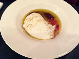 Burrata with red-pepper purée and tapenade.