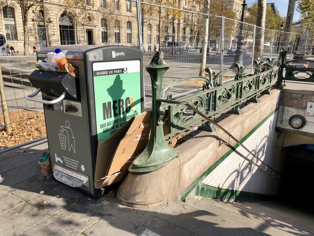 This ugly bin may be named "BigBelly," but its belly is apparently not big enough for all the trash on the Place de la Républque.