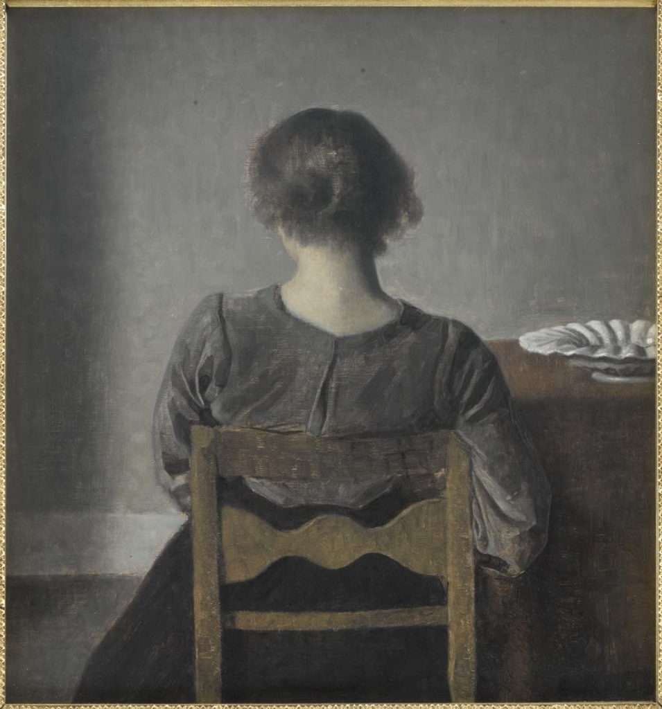 Hammershøi "Hvile (Rest)" (1905). One of the rare figures in a Hammershøi painting who looks relaxed, as she leans her weight against the back of the chair. Photo © RMN-Grand Palais (Musée d’Orsay)/René-Gabriel Ojéda