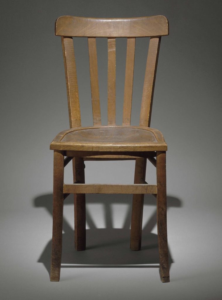 A member of the Resistance wrote a message to his comrades on the underside of this chair used in a Gestapo interrogation and torture room in Paris. Photo © Paris - Musée de l’Armée, Dist. RMN-Grand Palais/Laurent Sully-Jaulnes