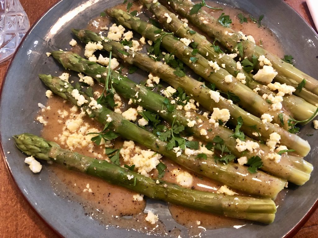 Asparagus with vinaigrette and mimoa.