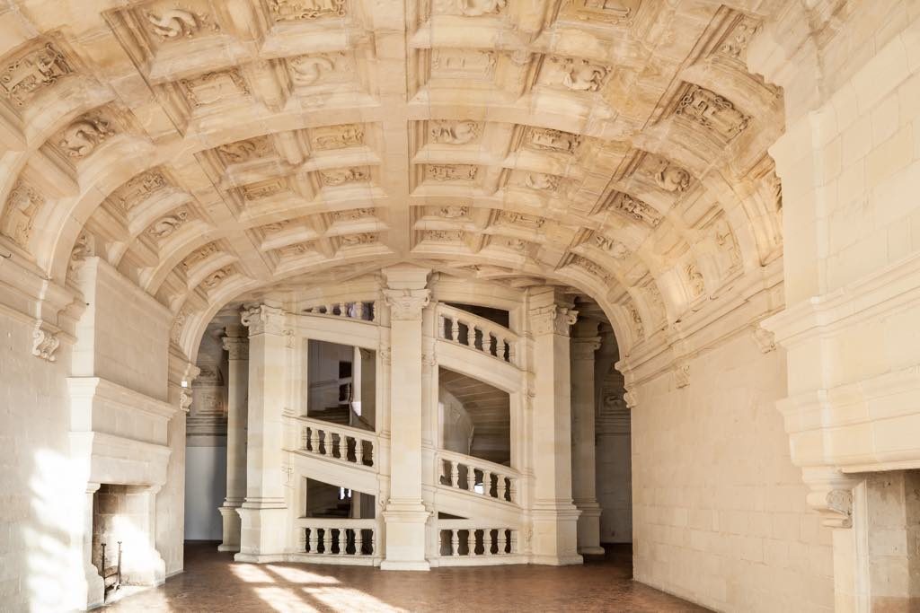 The double-spiral staircase and coffered ceiling in the Château de Chambord. 