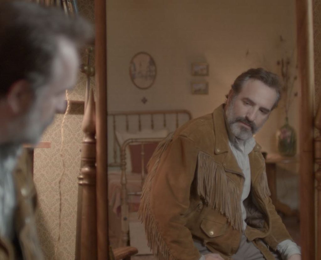 Jean Dujardin admires his new blouson in Quentin Dupieux’s Le Daim (Deerskin).