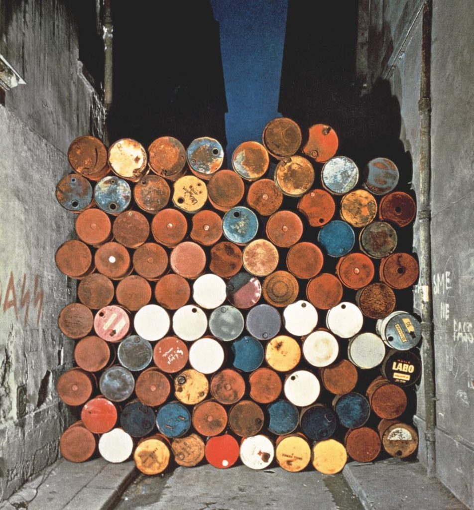 "Temporary Wall of Oil Barrels–The Iron Curtain" (1962). © Christo 1962 Photo © Jean-Dominique Lajoux 