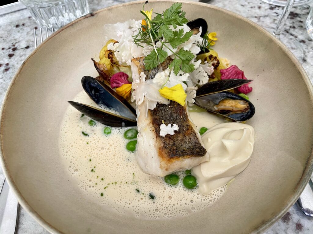 Fish of the day, bouchot mussels, roasted cauliflower, marinière sauce.